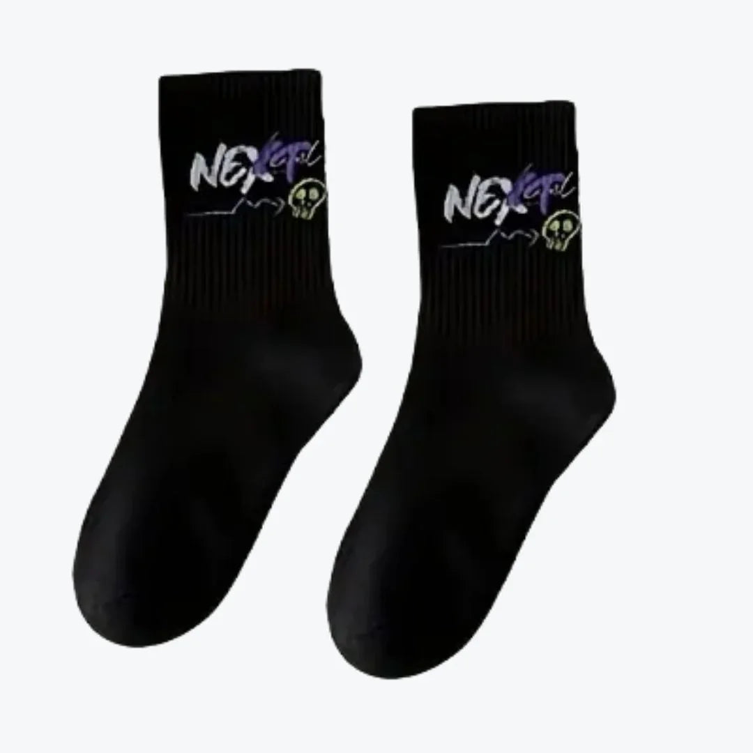 Pair of black socks with 'NEXT'