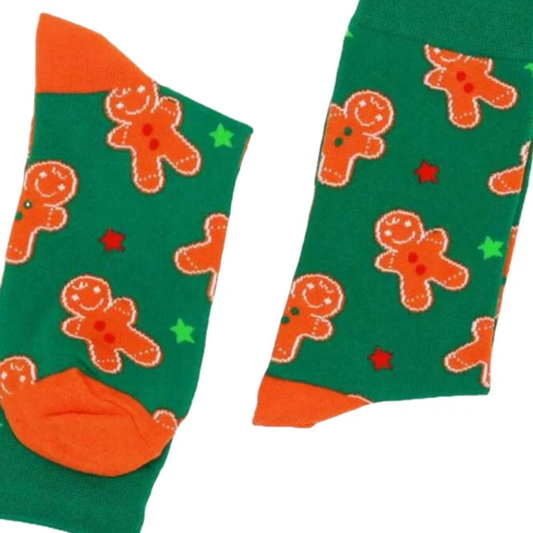 Green socks with orange gingerbread men pattern on a white background