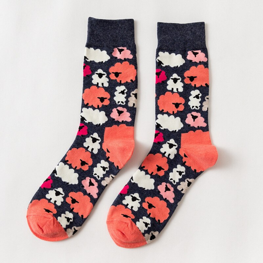 Pair of socks with sheep pattern on a white background