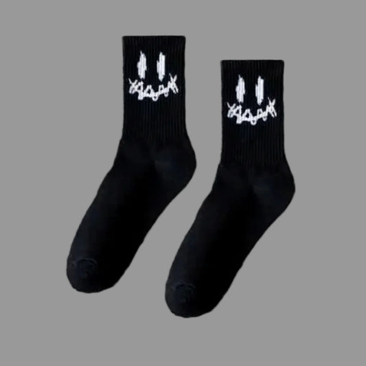 Black socks with white designs on a white background