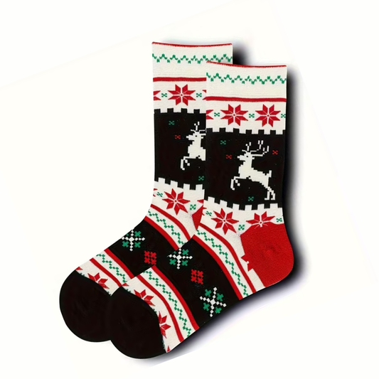 Christmas-themed socks with reindeer and snowflake pattern on a white background