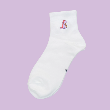 White ankle sock with a colorful embroidered design on a light purple background