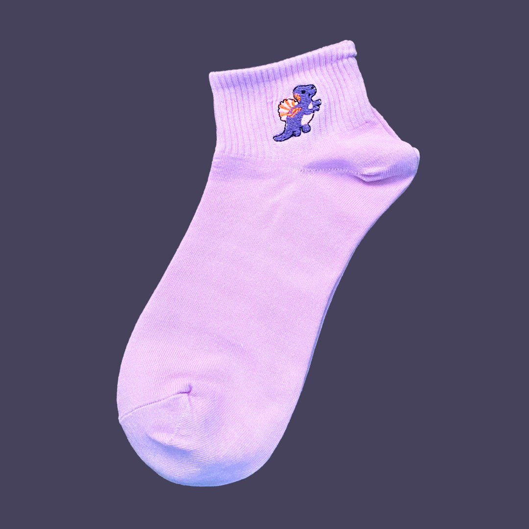 Purple sock with a small embroidered design on a dark background