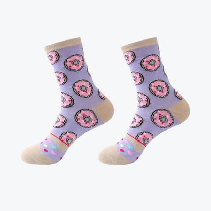 Pair of socks with donut pattern on a light purple background