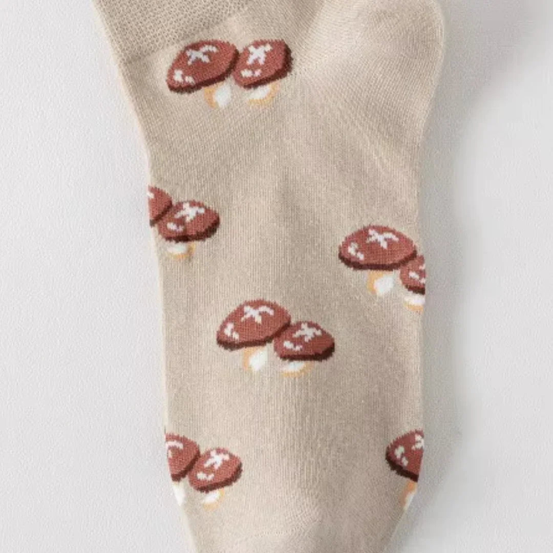 Beige sock with red and white pattern on a light gray background