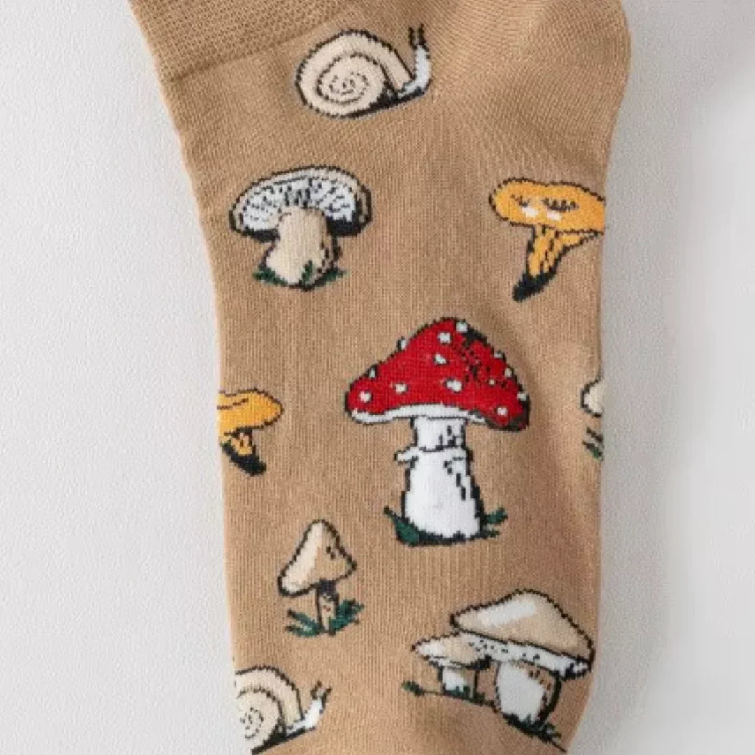 Brown sock with mushroom and snail pattern on a white background