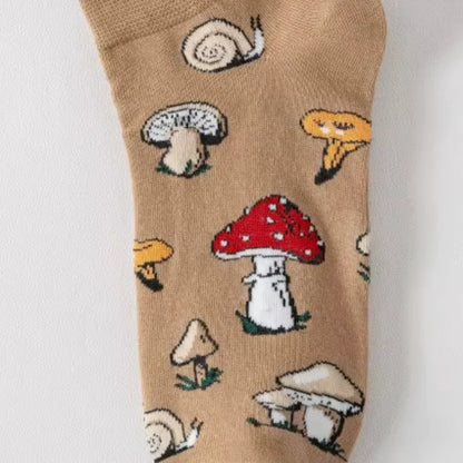 Brown sock with mushroom and snail pattern on a white background