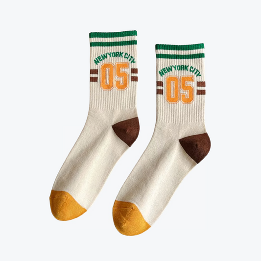 Pair of socks with 'New York City' and number '05' printed on a white background