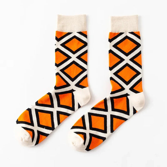 Pair of socks with orange and black geometric pattern 