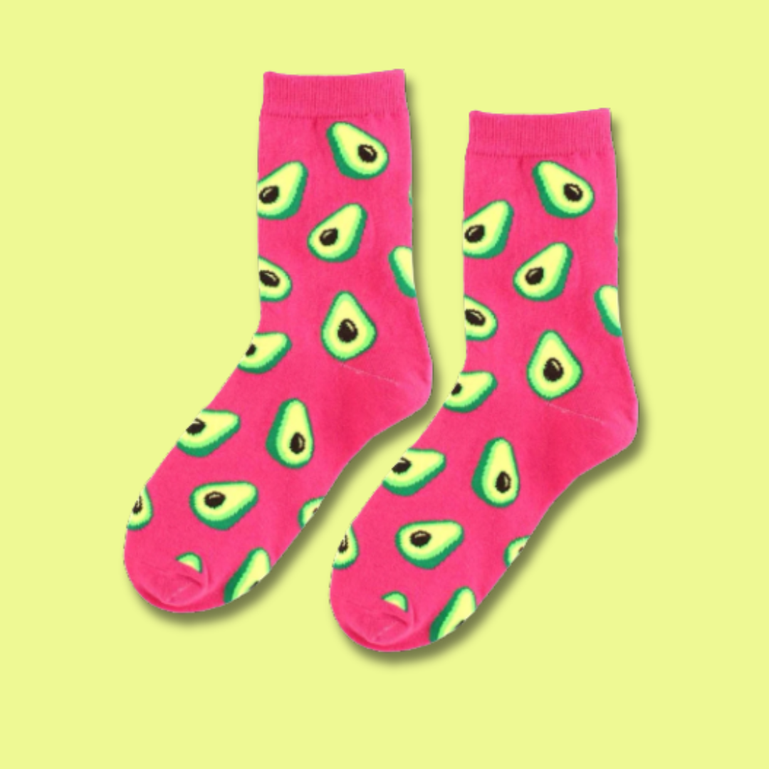 Pink socks with avocado pattern on a yellow background