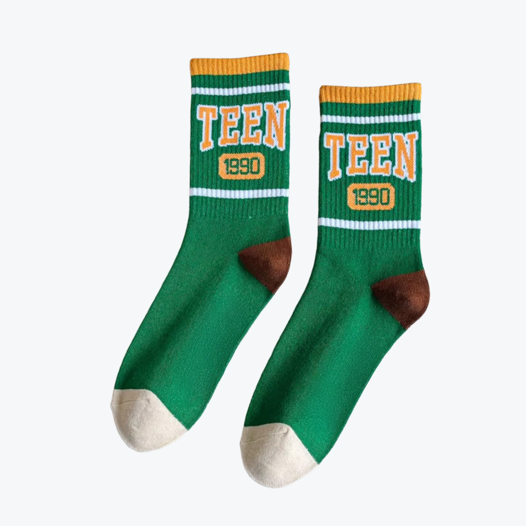 Green socks with 'TEEN 1990' text on a white background